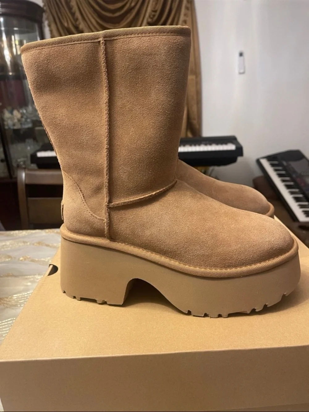 UGG Women's classic short new heights bootie’s size 7